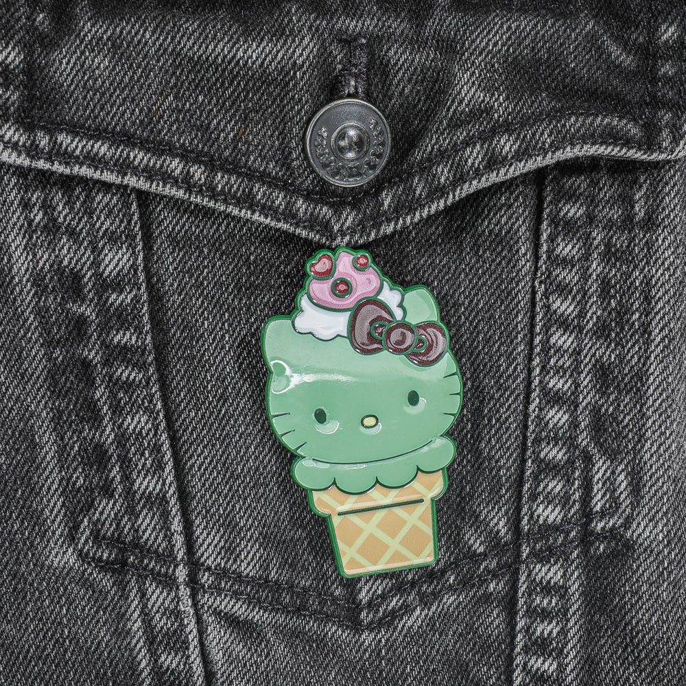 Bundle of 3 Hello Kitty® ice cream cone enamel pins by Sanrio, limited edition glow-in-the-dark matcha and chocolate designs.