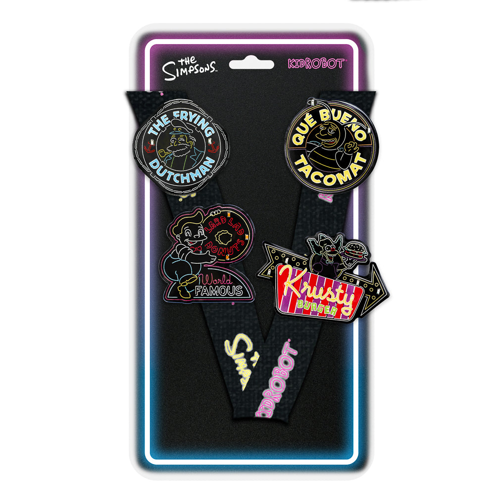 The Simpsons SDCC 2024 neon signs pins and lanyard set on card, featuring bright light-up design and limited edition packaging.