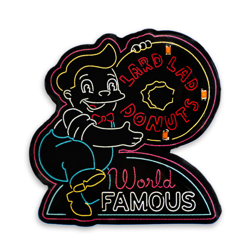 The Simpsons SDCC 2024 neon signs light-up pins and lanyard set, limited edition collectibles featuring colorful Simpsons characters.