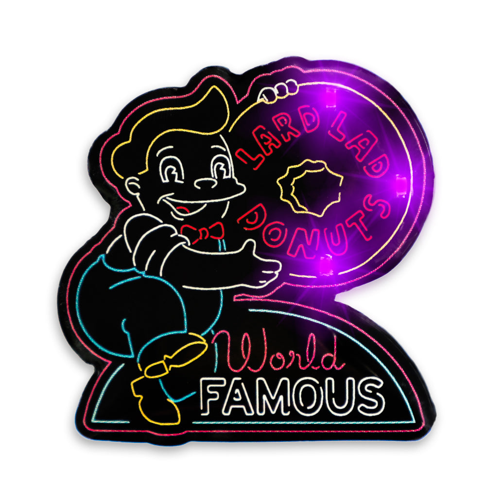 The Simpsons SDCC 2024 neon signs light-up pins and lanyard set, limited edition with colorful neon design and cartoon characters.