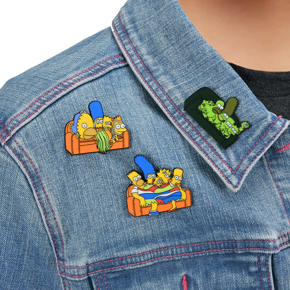 The Simpsons Couch Gag enamel pin series featuring colorful character designs from the popular animated show.