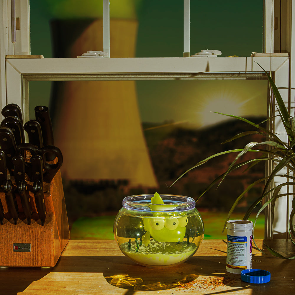 The Simpsons - Blinky in Fish Bowl 5.5” Glow-in-the-Dark Vinyl Art Figure (Radioactive Edition) - Kidrobot.com Exclusive