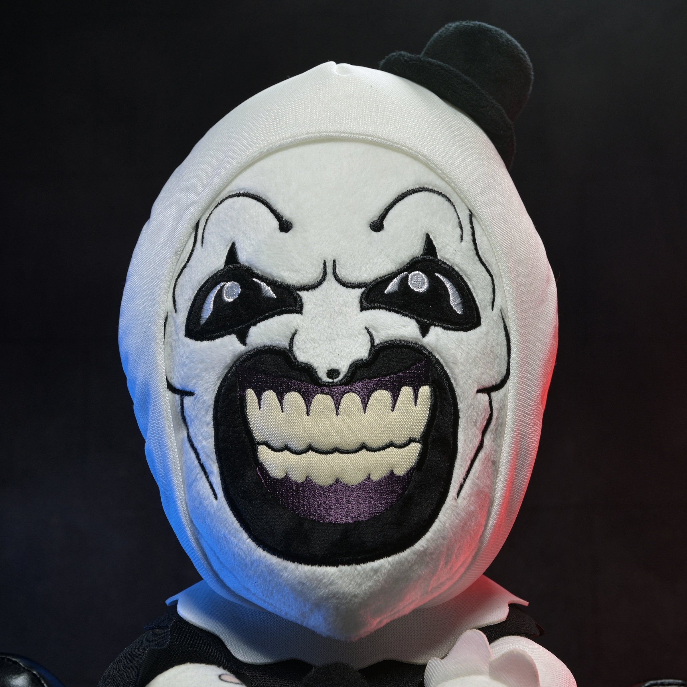 Large Art the Clown plush from Terrifier 3 featuring detailed design and soft fabric, perfect for fans of the horror character.