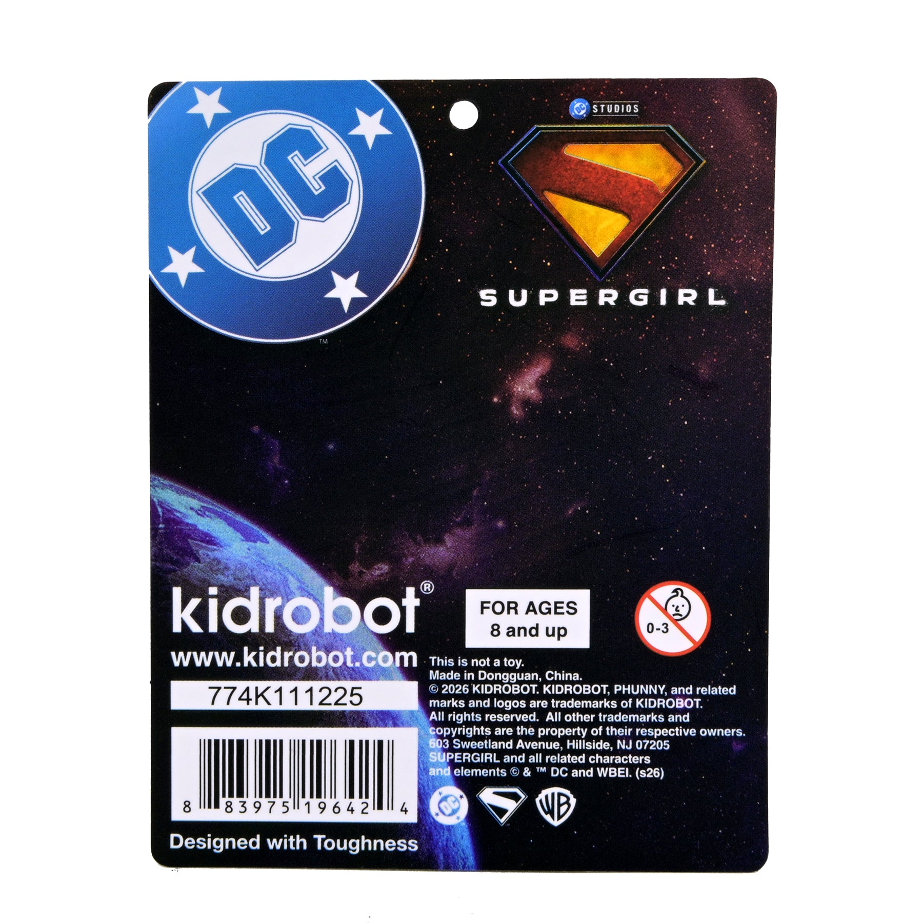 Supergirl plush window clinger featuring Supergirl logo and vibrant colors, designed to attach easily to windows.