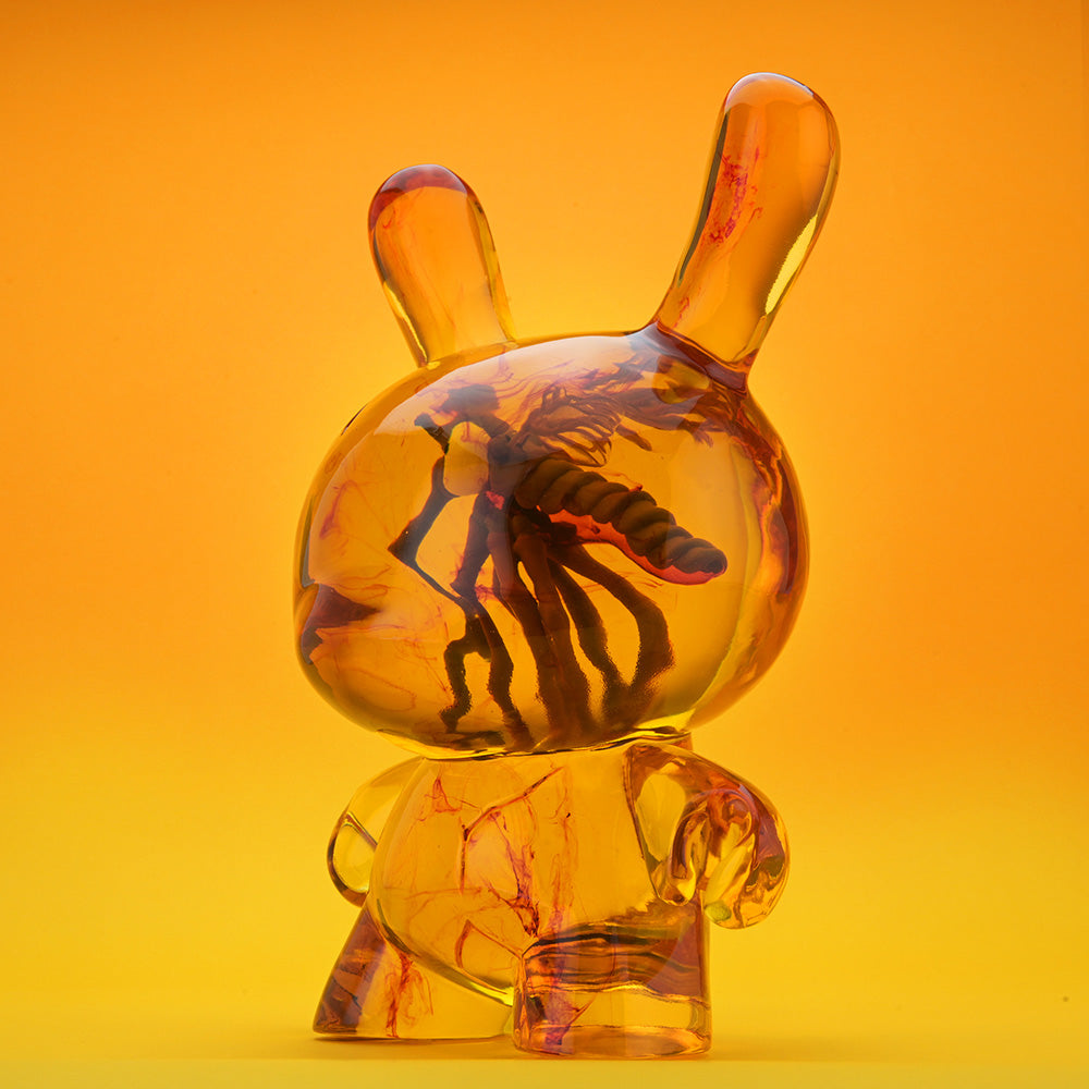 Amber Dunny 8-inch resin art figure by Kidrobot, pre-order, featuring a stylized Dunny design with vibrant amber color.