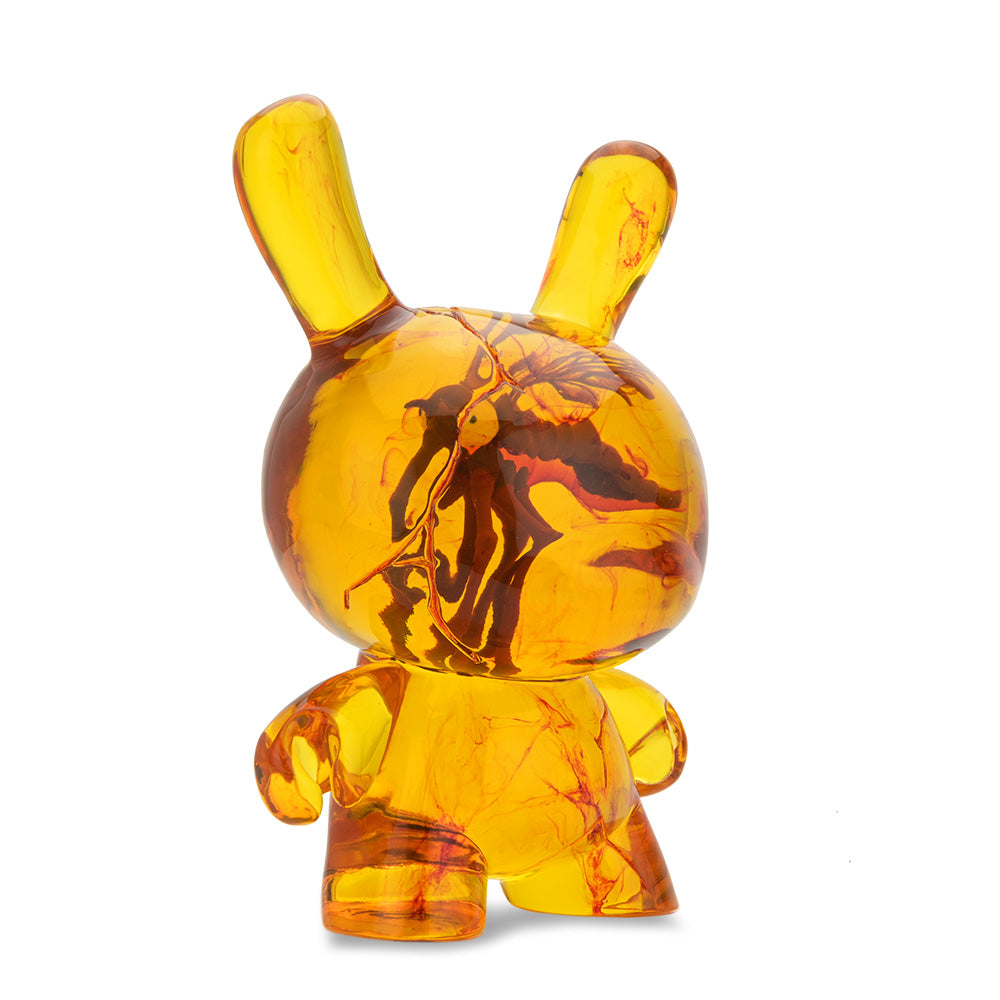 Amber Dunny 8-inch resin art figure by Kidrobot, showing a stylized Dunny design with amber-colored resin and artistic details.