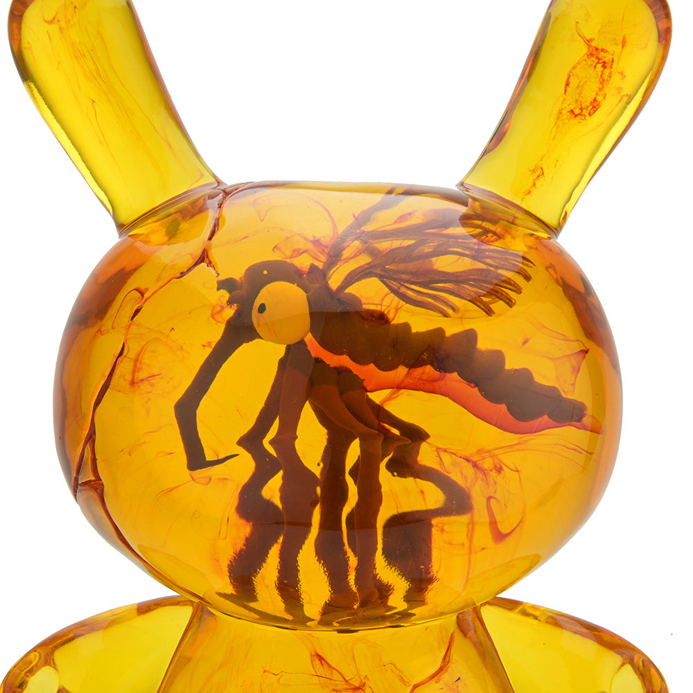 Amber Dunny 8-inch resin art figure by Kidrobot, featuring a stylized Dunny design with vibrant amber color and detailed artistic details.