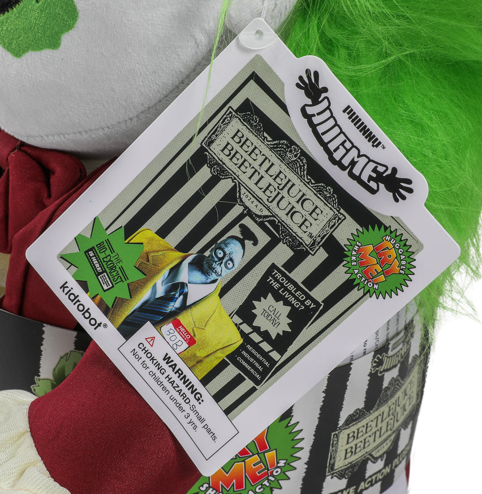 Kidrobot Beetlejuice HugMe plush in red suit with shake action, featuring detailed character design from the Beetlejuice series.