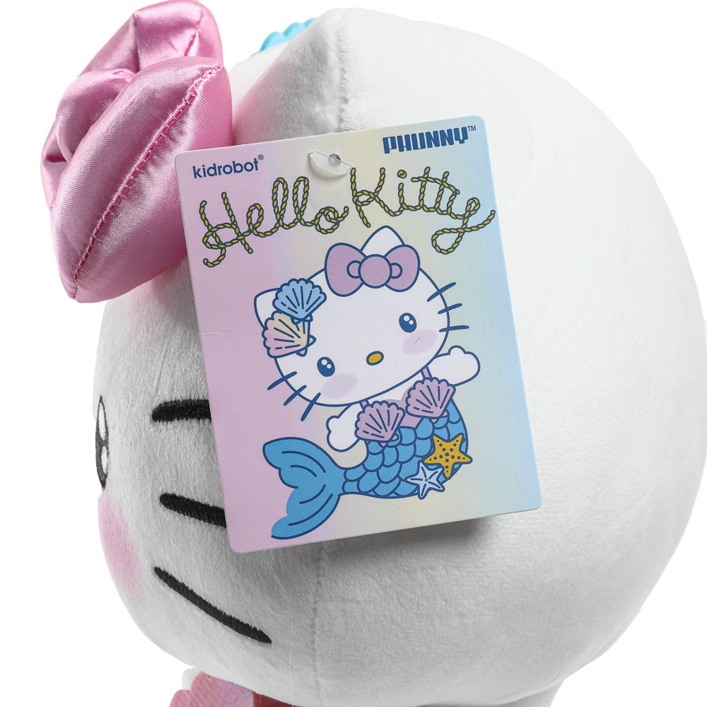 Hello Kitty® Mermaid plush by Kidrobot featuring a cute pink mermaid design with fins and a smiling face, Sanrio character.