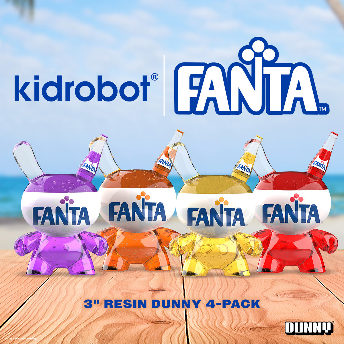 Set of four Kidrobot Coca-Cola Fanta resin Dunny art figures, 3-inch collectible toys with vibrant, detailed designs.