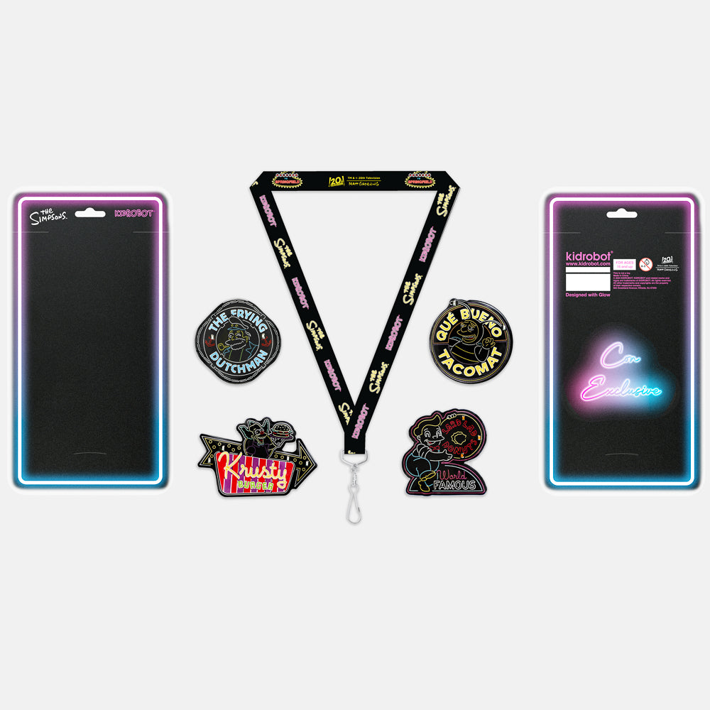The Simpsons SDCC 2024 neon signs light-up pins and lanyard set with limited edition enamel pins displayed.