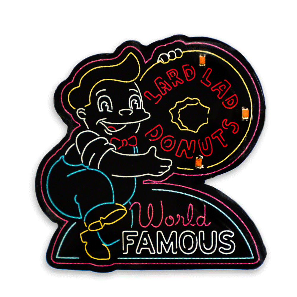 The Simpsons SDCC 2024 neon signs light-up pins and lanyard set, limited edition enamel pins with colorful design and branded lanyard.