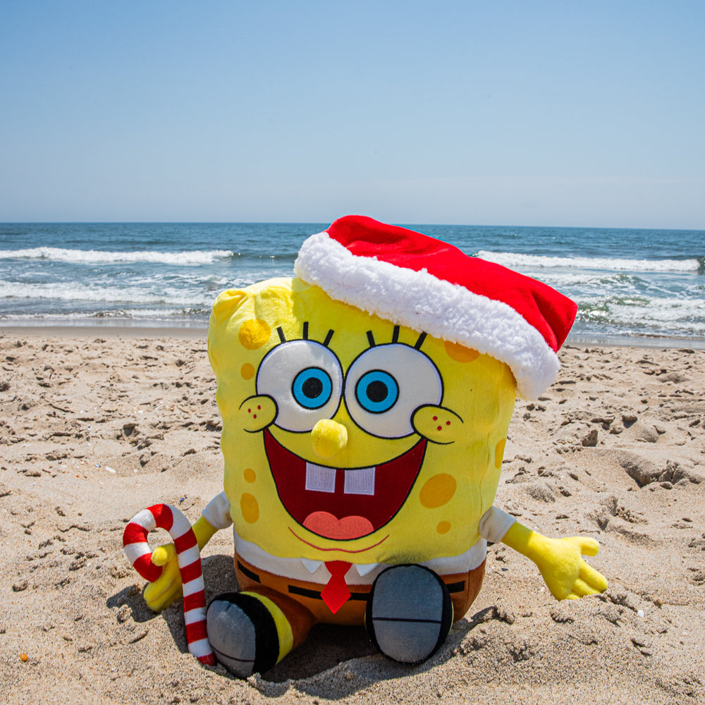 SpongeBob SquarePants Santa plush toy with shake action, featuring SpongeBob in a Santa outfit hugging and smiling.