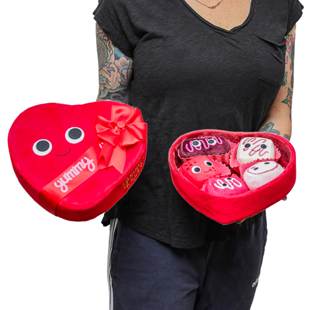 Yummy World Amore plush toy resembling a heart-shaped box of chocolates, soft interactive plush by Yummy World.