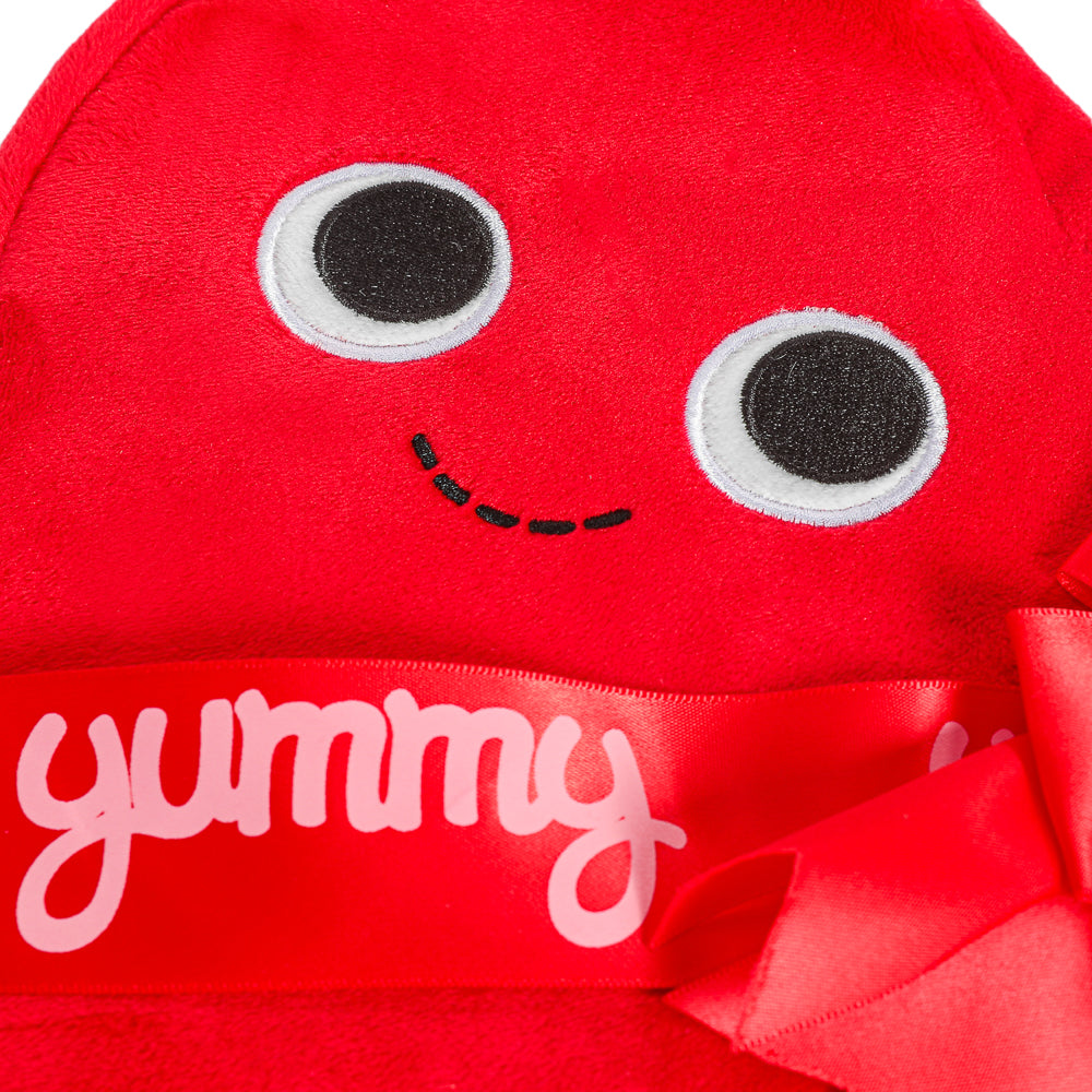 Yummy World Amore plush toy resembling a heart-shaped box of chocolates, soft and interactive, from the Yummy World collection.
