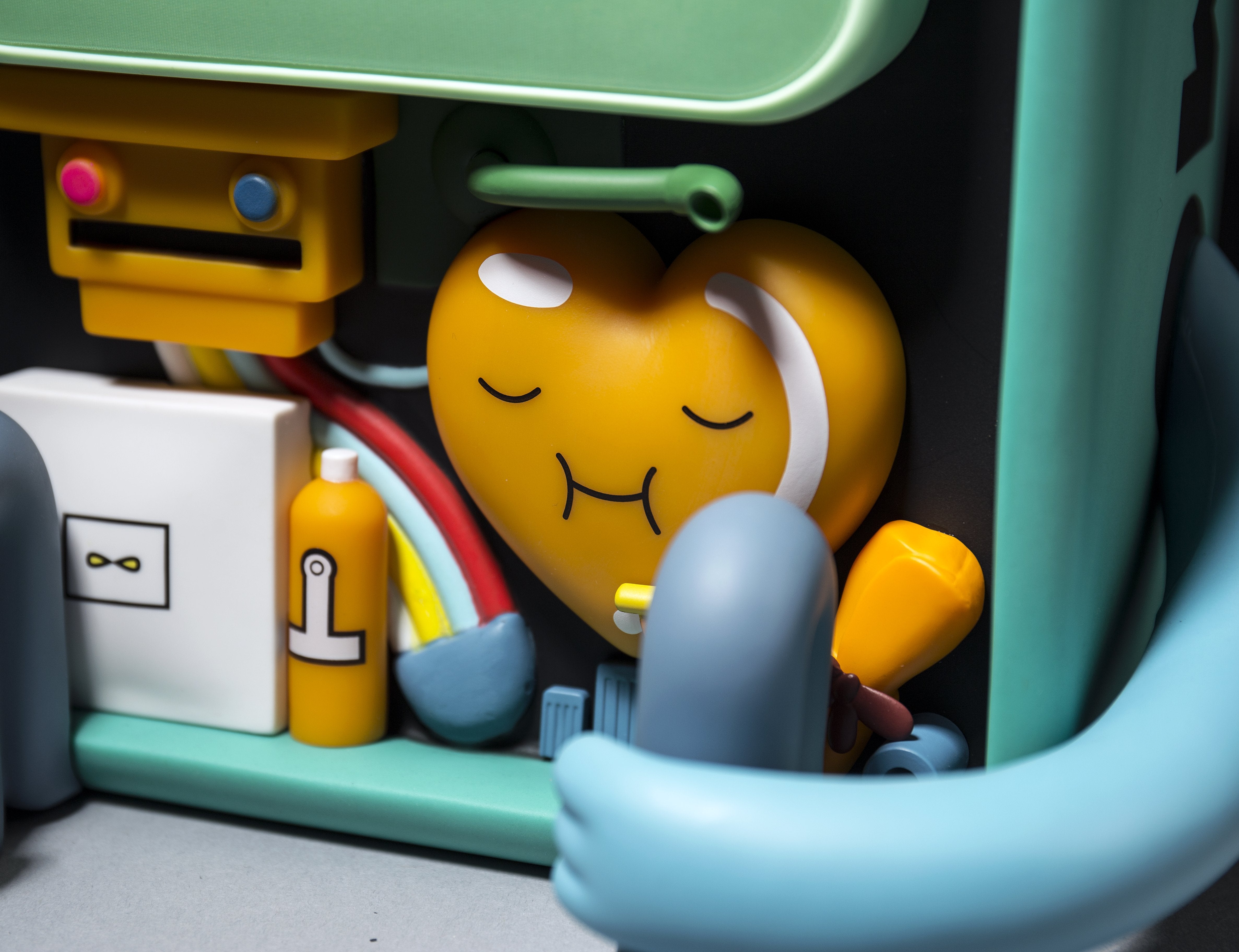 Adventure Time BMO vinyl art figure by Kidrobot, detailed collectible with vibrant colors and playful design.