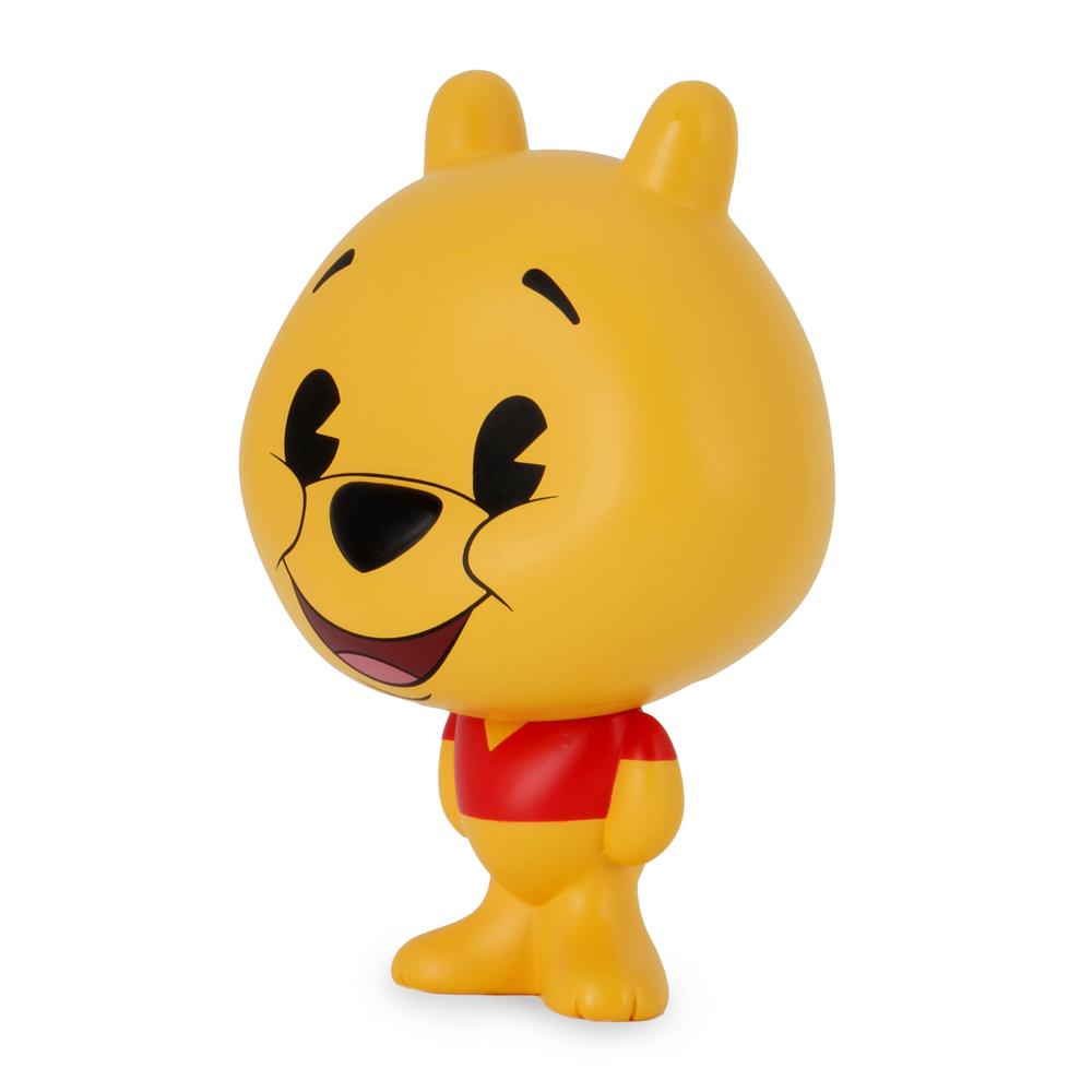 Disney Winnie the Pooh Bhunny 4-inch vinyl figure, depicting the classic stuffed bear with soft yellow fur and red shirt.