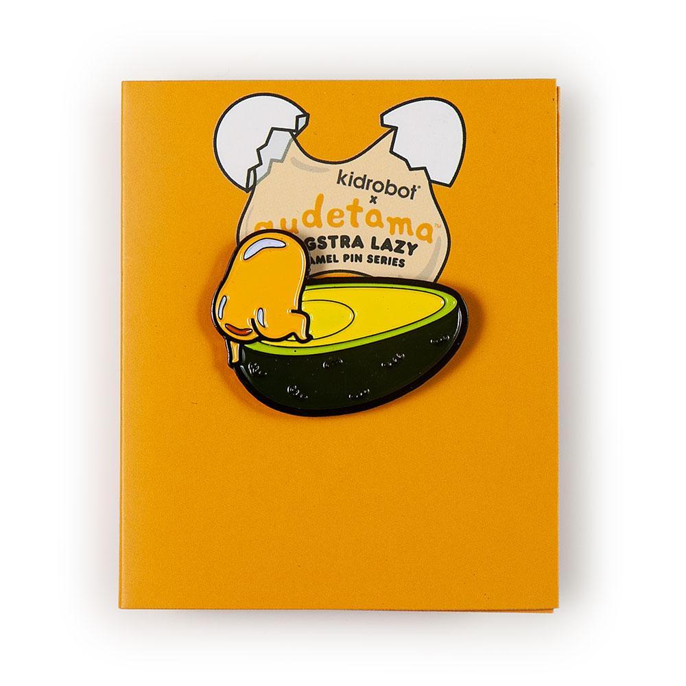 Gudetama Eggstra Lazy enamel pin from Kidrobot x Sanrio series, featuring a cute, relaxed egg character in a blind box packaging.