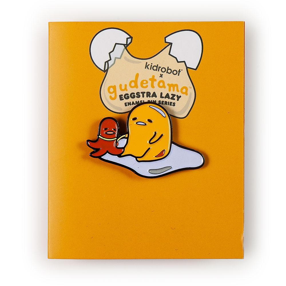 Gudetama Eggstra Lazy enamel pin from Kidrobot x Sanrio, featuring a cute, relaxed Gudetama character on a collectible pin.