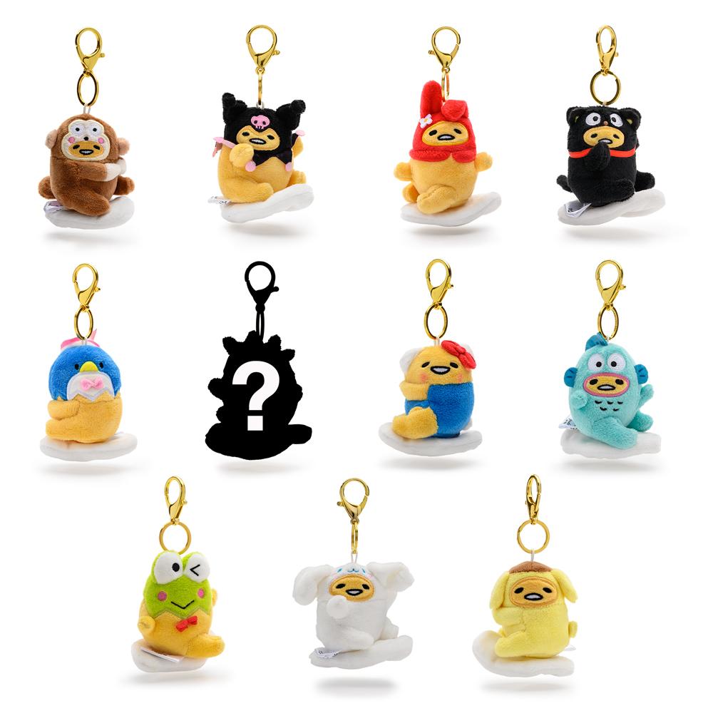 Gudetama the Lazy Egg plush charm keychain by Kidrobot x Sanrio, soft yellow plush with cute egg-shaped design and keyring attachment.