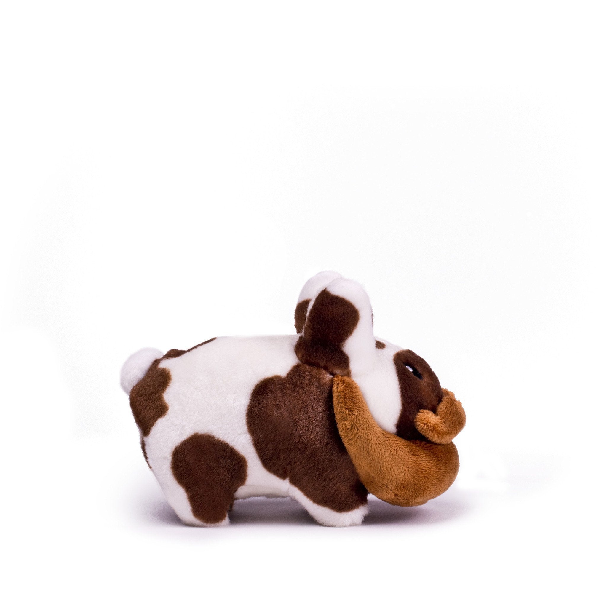 Brown Happy Labbit Cow 7-inch plush stuffed animal by Frank Kozik, soft polyester fabric with detailed cow features.