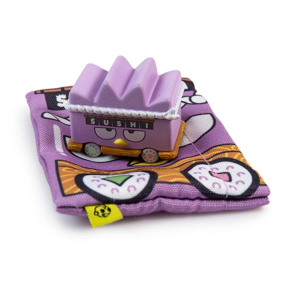 Sanrio Hello Kitty micro vehicle art figure from Kidrobot blind bag series, vinyl collectible with colorful design.