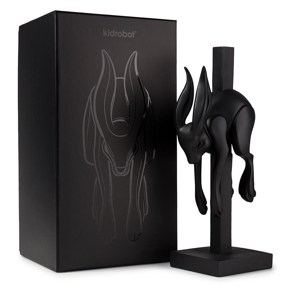 Matte black resin art figure titled "Jumper" by Colus Havenga, showcasing a modern abstract sculpture with smooth finish.
