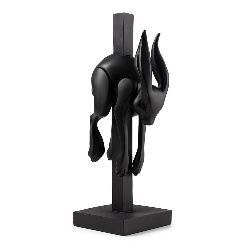 Matte black resin art figure named Jumper by Colus Havenga, featuring a modern, abstract design with smooth surfaces and detailed craftsmanship.