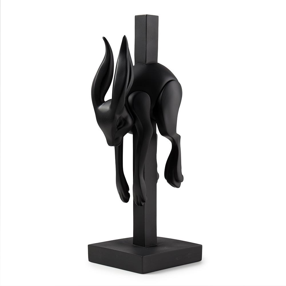 Matte black resin art figure of a jumper by Colus Havenga, detailed sculpture with smooth finish and artistic design.