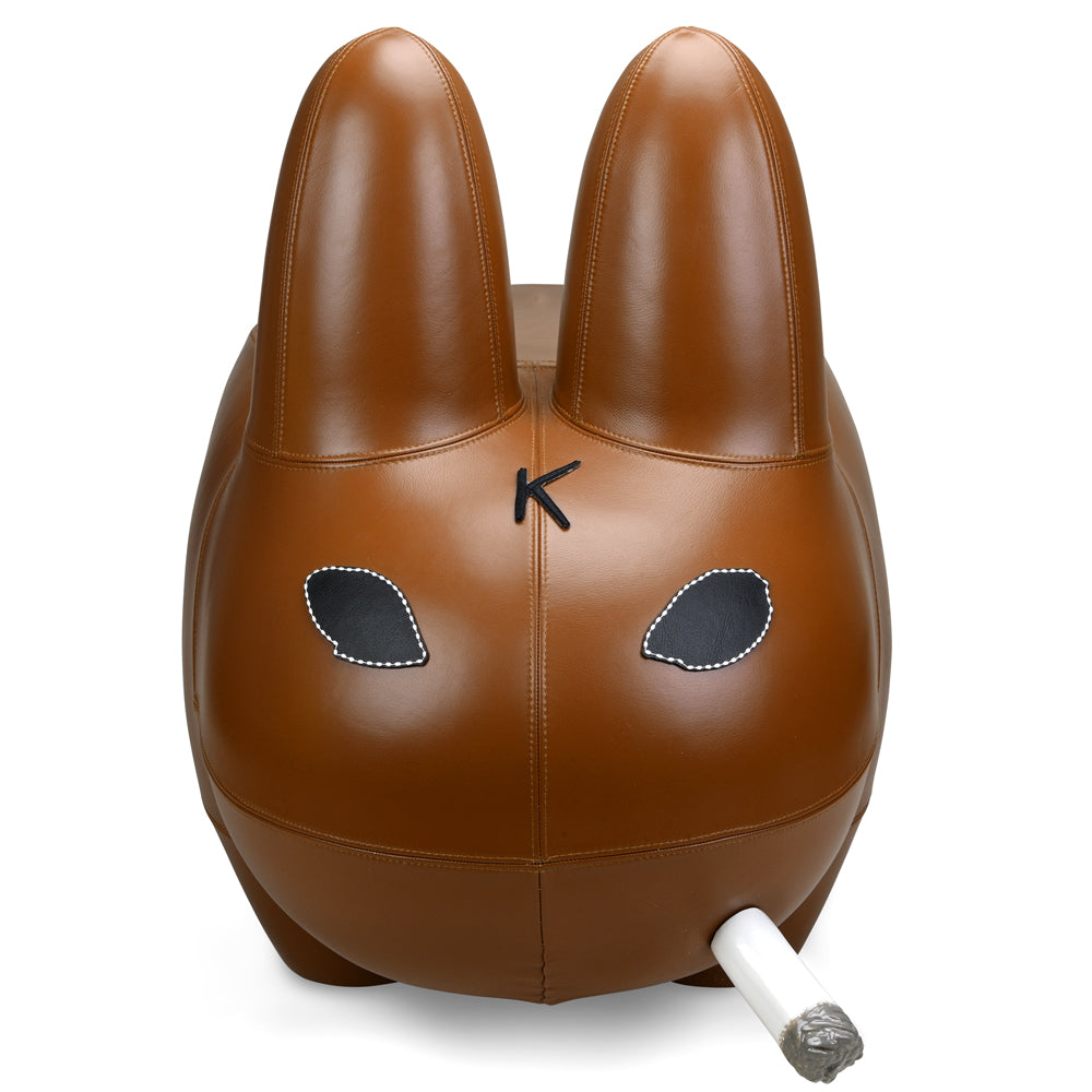 Kidrobot Art Giant Leather Smorkin' Labbit Stool in brown, featuring a detailed, textured leather Labbit design for unique home decor.