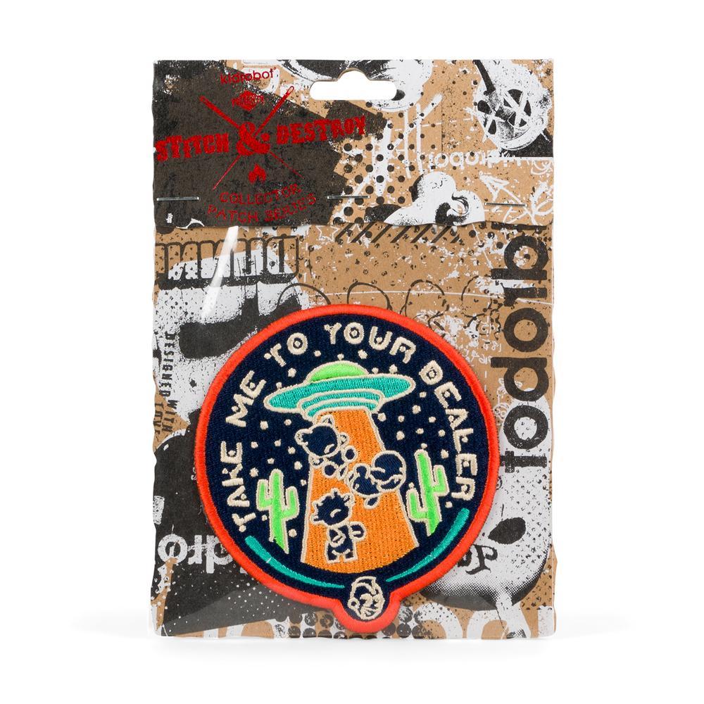 Kidrobot Stitch & Destroy Patch featuring a colorful design with the phrase "Take Me To Your Dealer," perfect for clothing or accessories.