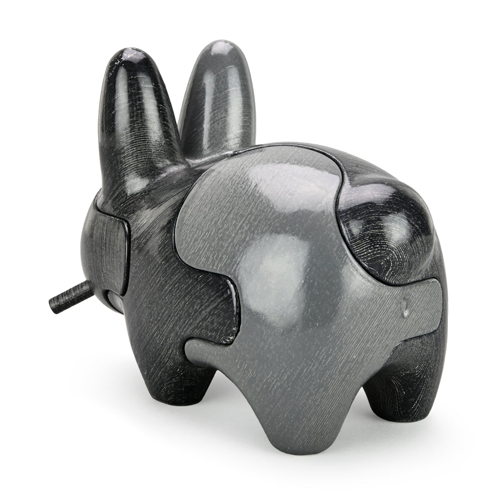 Locknesters Interchangeable Puzzle Labbit No. 1 collectible figure with customizable features, displayed in a vibrant pose.