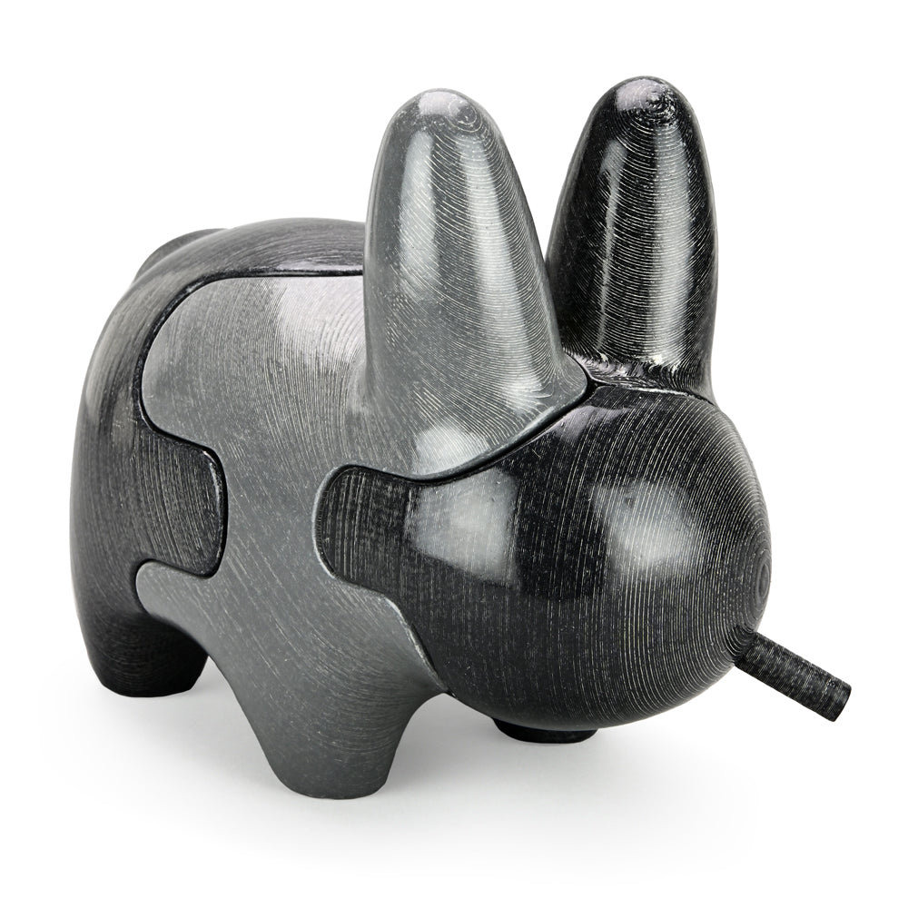 Locknesters Interchangeable Puzzle Labbit No. 1 figure with colorful puzzle pieces and detailed design.
