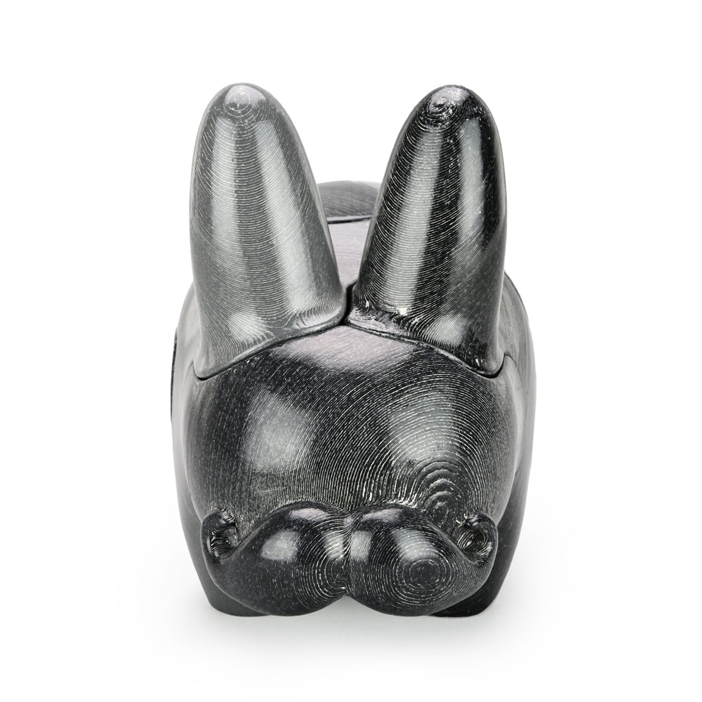 Locknesters Interchangeable Puzzle Labbit No. 1 toy with customizable features, displayed in a playful pose.