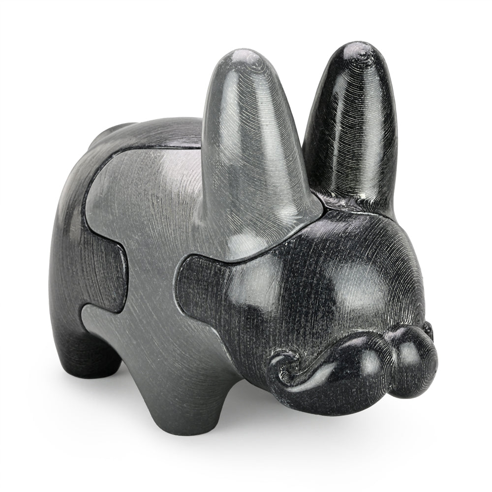 Locknesters Interchangeable Puzzle Labbit No. 1 featuring a playful Labbit figure with customizable puzzle parts, in vibrant colors.