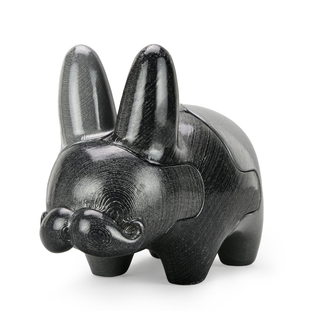 Locknesters Interchangeable Puzzle Labbit No. 1 collectible toy with customizable features, shown in a playful pose.