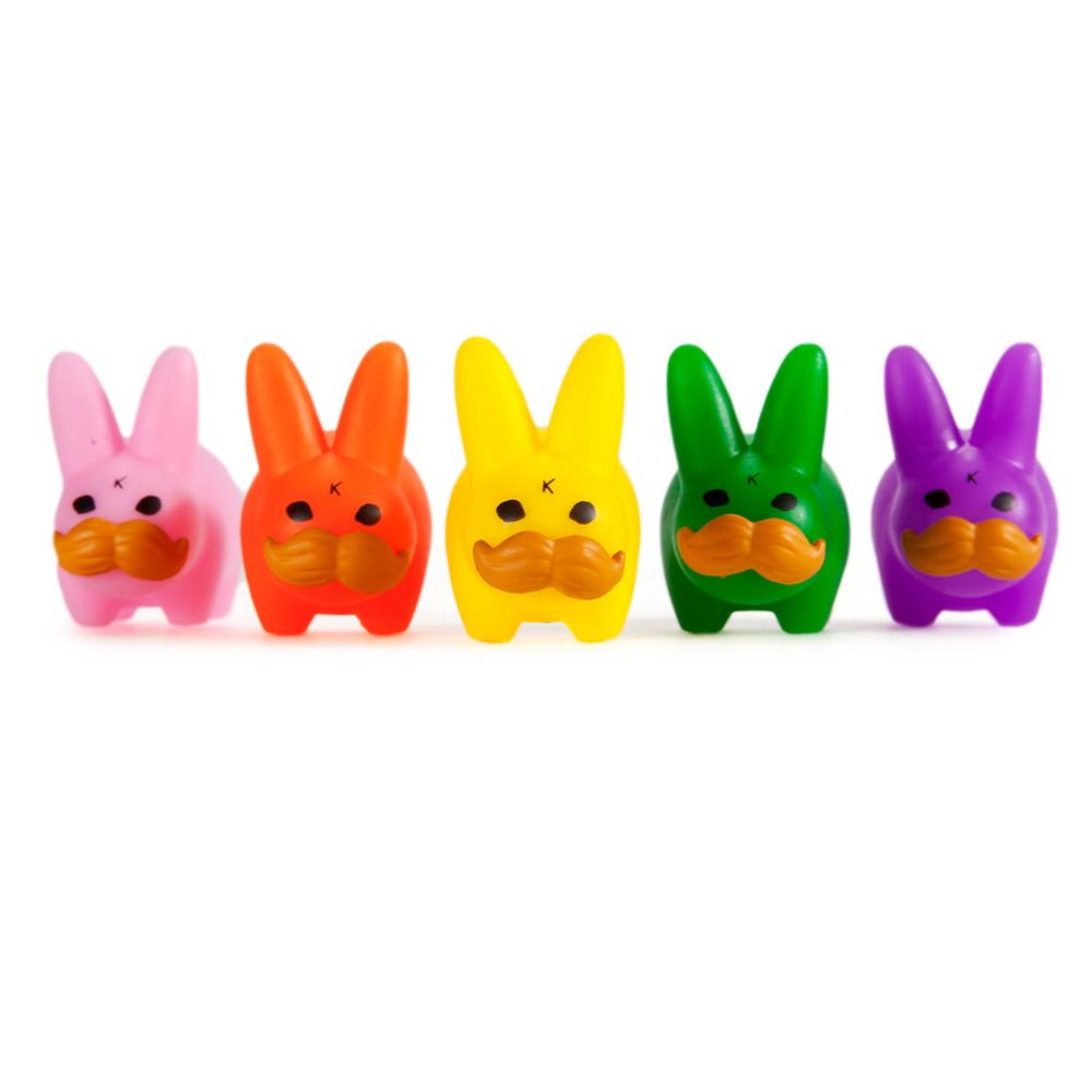Set of five colorful vinyl Labbit Pride 'Stache Labbit art toys featuring vibrant designs and expressive faces.