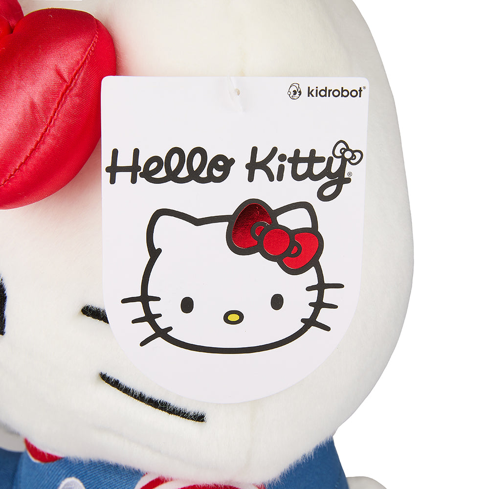 Sanrio Hello Kitty 13-inch plush toy, soft and cuddly with signature pink bow, perfect for collectors and fans.