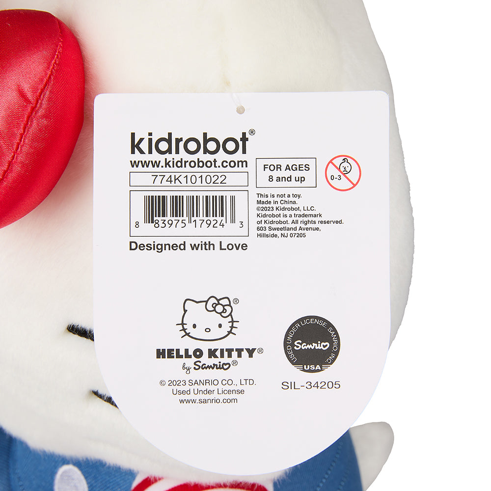 Sanrio Hello Kitty 13-inch plush toy, soft and cuddly with iconic Hello Kitty face and pink bow, perfect for fans.