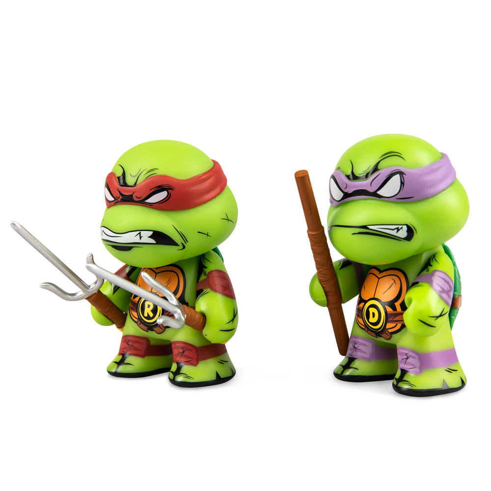 Teenage Mutant Ninja Turtles Raphael and Donatello 3-inch vinyl mini figures 2-pack, featuring detailed character designs.