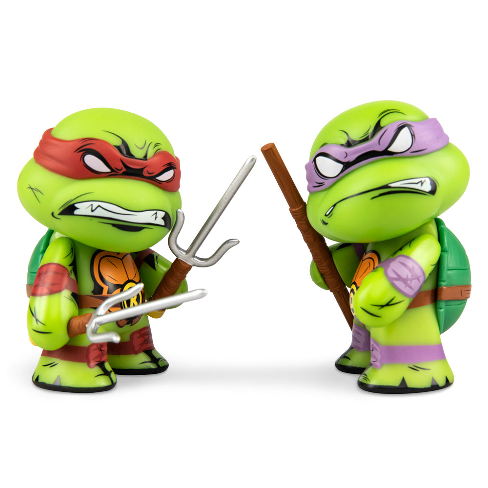 Teenage Mutant Ninja Turtles Raphael and Donatello 3-inch vinyl mini figures in a 2-pack, featuring detailed turtle character designs.