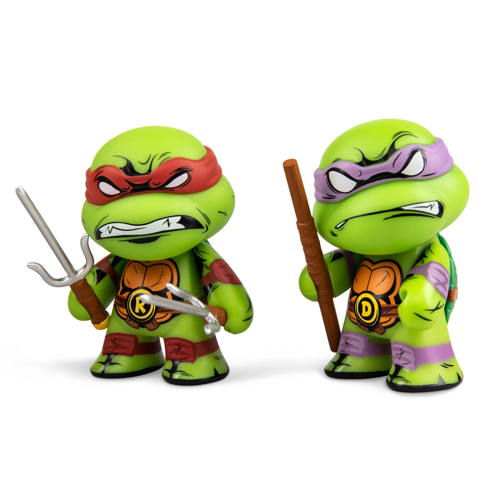 Teenage Mutant Ninja Turtles Raphael and Donatello 3-inch vinyl mini figures 2-pack, featuring detailed turtle character designs.