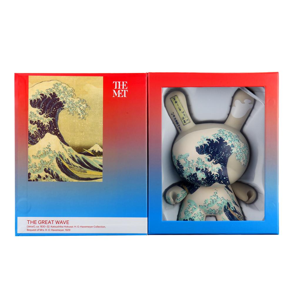The Met 8-Inch Masterpiece Dunny featuring Hokusai Great Wave design, collectible art toy with detailed blue wave illustration.