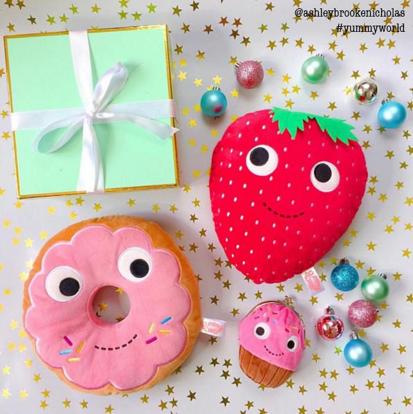 Heidi Kenney Yummy World Strawberry 10-inch plush pillow featuring a soft, colorful strawberry design for cozy comfort.